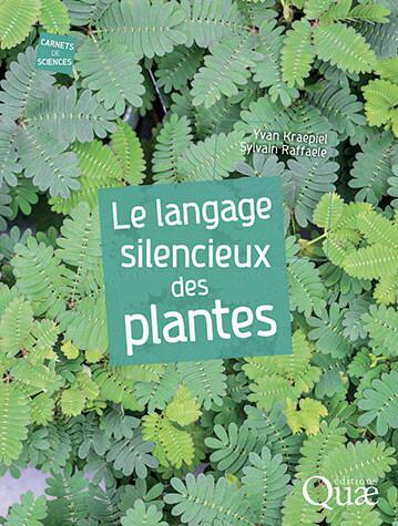 couverture Le Langage Silencieux des Plantes, titre écrit en blanc sur une photo de feuilles vertes